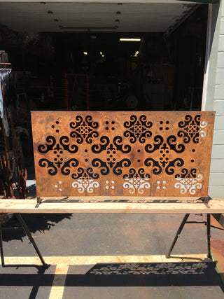 large outdoor metal wall hanging